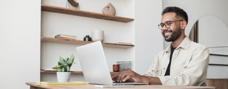 Handsome man using laptop working at home, online meeting, distance studying business internship in Japan