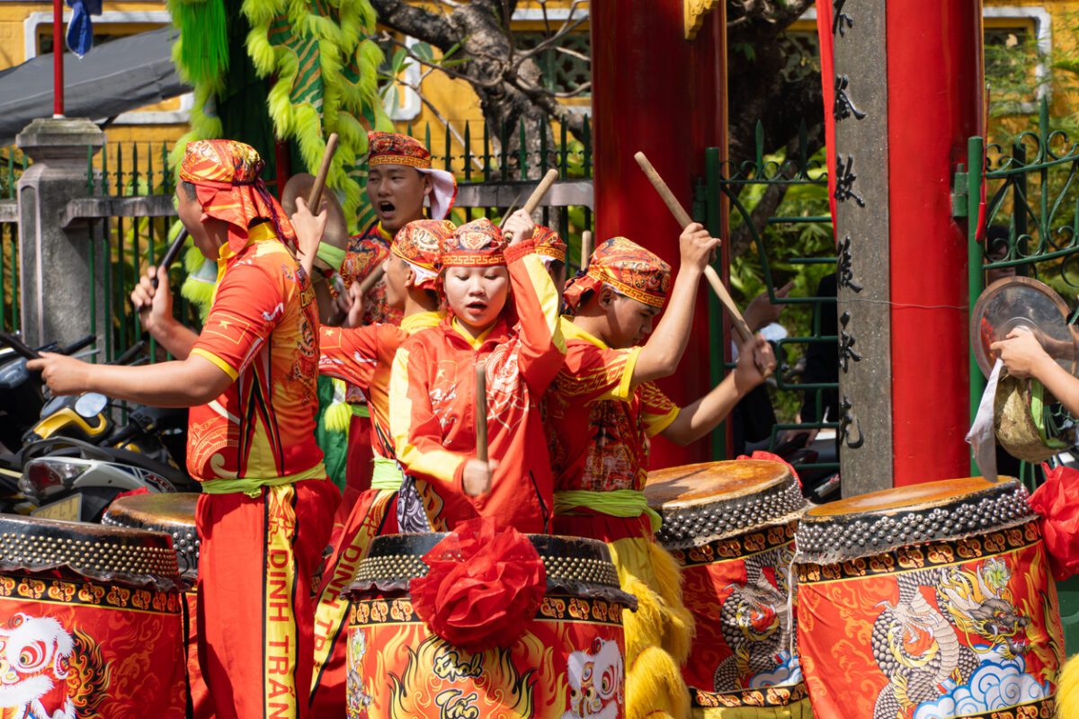 Young Vietnamese people dressed in bright colors playing drums volunteer southeast asia volunteer work southeast asia southeast asia volunteer programs southeast asia volunteer southeast asia volunteer programs non profit southeast asia volunteer companies